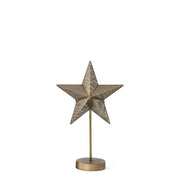 Decorative star table lamp with a metallic golden brass base on a white background