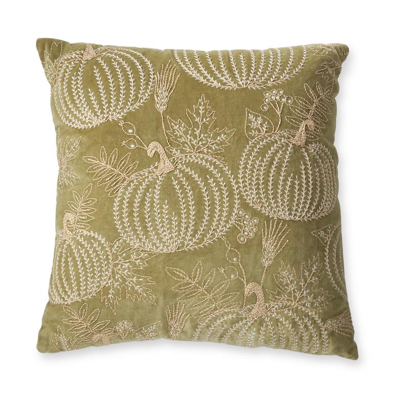 An olive green velvet throw pillow featuring a raised, embroidered pattern of pumpkins and autumn leaves in a light beige thread, shown against a plain white background.