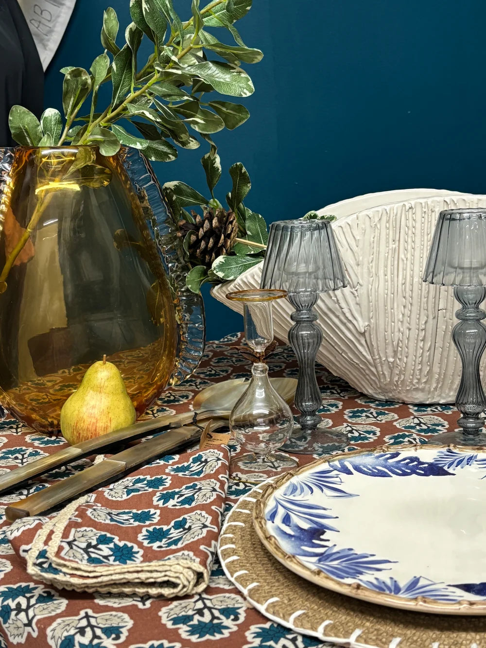Cinnamon brown floral tablecloth on a set dining table