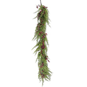 A hanging artificial evergreen garland with dense green needle-like foliage and clusters of small red berries, suspended against a plain white background.
