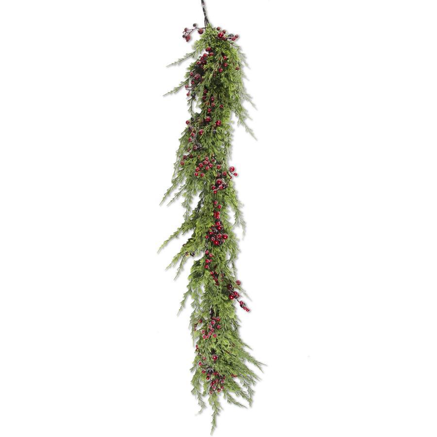 A hanging artificial evergreen garland with dense green needle-like foliage and clusters of small red berries, suspended against a plain white background.