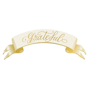 Grateful banner table accent with 'Grateful' text in ivory with gold foil calligraphy by Hester & Cook.